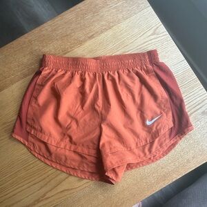 Burnt orange Nike tempo running shorts. Women’s size medium.